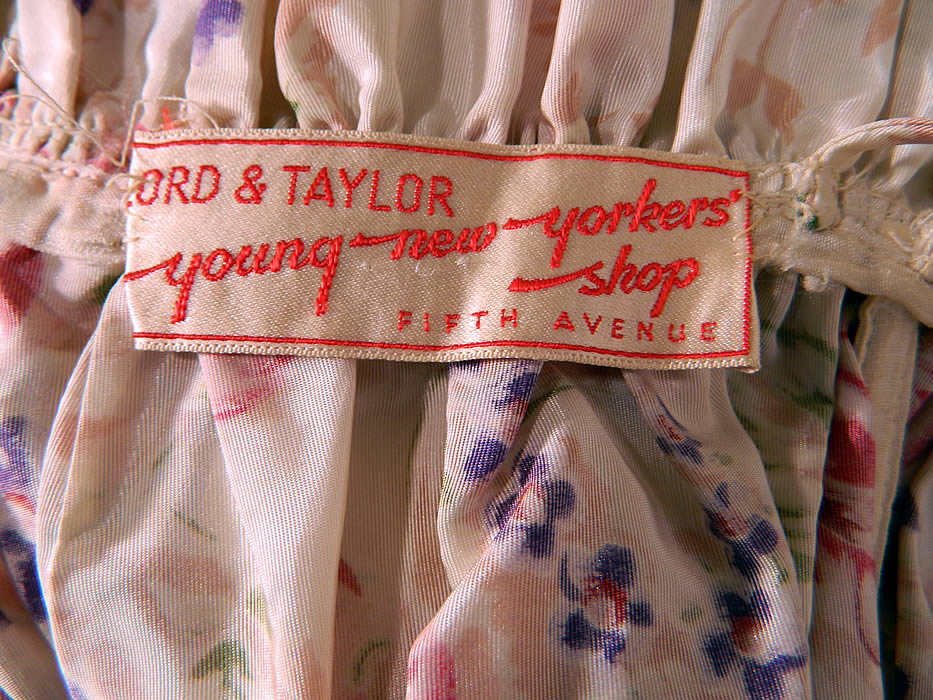 Vintage Lord & Taylor Young New Yorkers Floral Pastel Rayon Taffeta Dress Gown. There is a "Lord & Taylor Young New Yorkers Shop Fifth Avenue" store tag sewn inside. The dress measures 60 inches long, with a 28 inch waist and 36 inch bust. It is in good condition. This would make for a wonderful garden bridal party bridesmaid dress! 