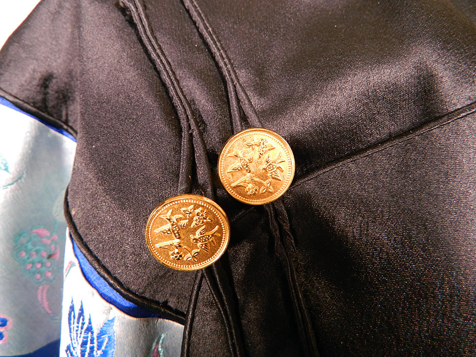 Antique Chinese Royal Blue Silk Brocade Embroidered Butterfly Sleeve Band Robe Coat. This magnificent Manchu style court robe is loose fitting, a long mid length, with a high neckline, long wide full sleeves and a side opening with black silk loop toggles and carved gold brass buttons with a bird design. 