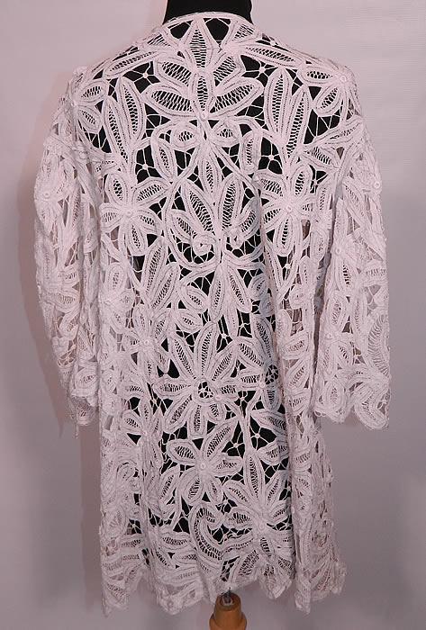 Edwardian Antique  White Battenburg Tape Lace Bell Sleeve Coat Jacket. The coat measures 32 inches long, with 46 inch hips, a 46 inch waist, 36 inch bust, 15 inch back and 14 inch long sleeves.