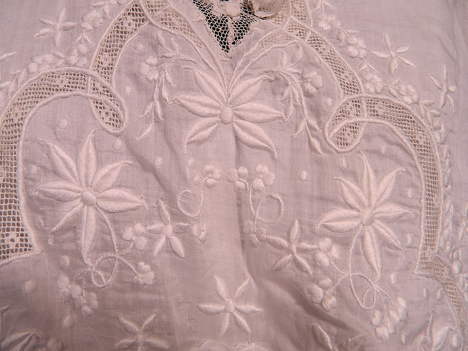 Edwardian Titanic Embroidered White Batiste  Net Lace Tiered Dress. This lovely lace dress is a long floor length, with a layered bib style overlay top, lace trim collar, 3/4 length sleeves and a layered tiered scalloped ruffle skirt. It is fully lined in silk on the skirt, cotton on the top, with hook closures hidden inside the front.