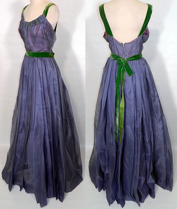 Vintage Blue Organdy Pink Taffeta Green Velvet Trim Formal Gown Dress. This pretty prom party dress formal evening gown has a gathered neckline, backless, with shoulder straps, a belted bow sash, long floor length full skirt and back zipper closure. The dress measures 60 inches long, with a 26 inch waist and 36 inch bust.