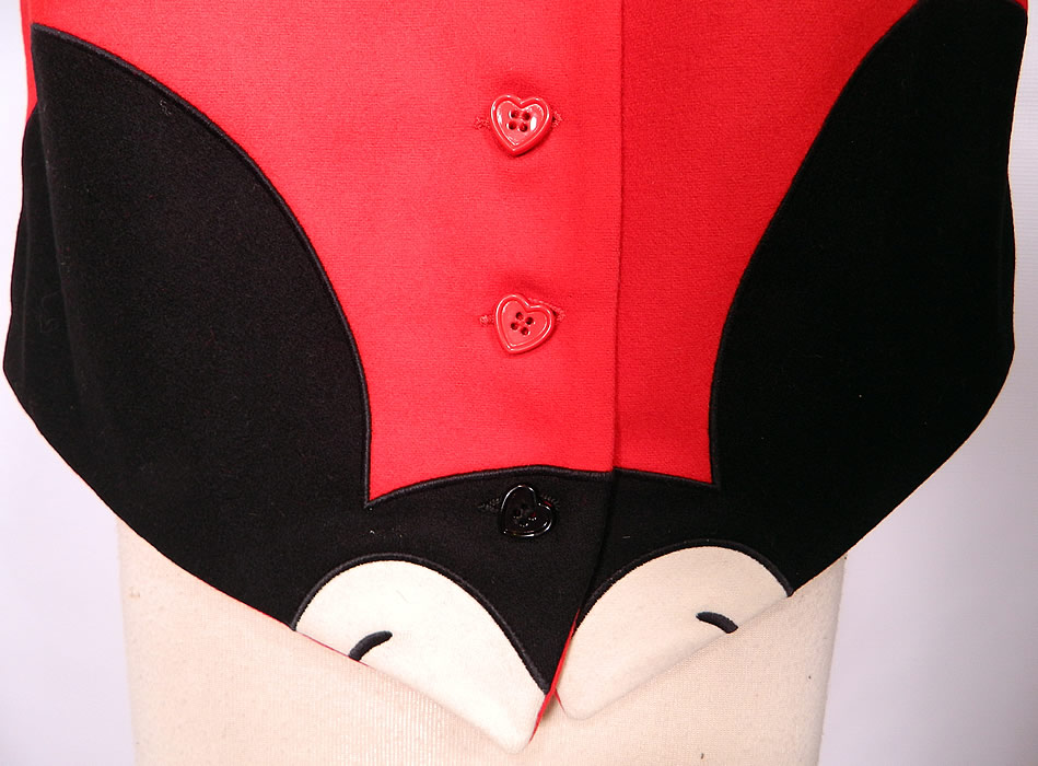 Vintage Cheap & Chic Moschino Black & White Red Wool Mickey Mouse Vest Top. This fun Disney inspired designer hidden Mickey Mouse vest is sleeveless, with red heart shaped buttons for closure down the front and has an adjustable belted buckle back. 