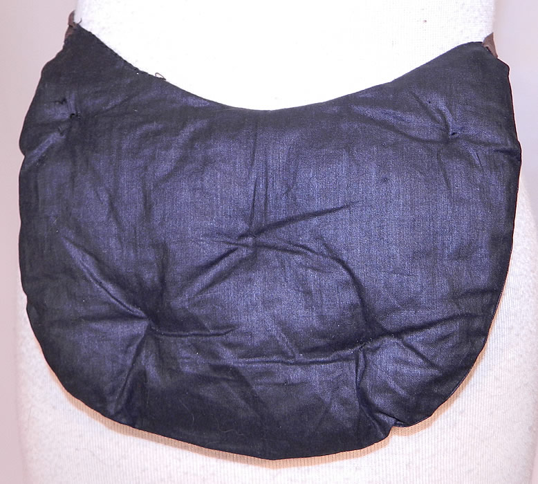 Victorian Quilted Horse Hair Black Polished Cotton Crinolette Bustle Pad Support. It is made of a black polished cotton fabric, stuffed with horse hair and quilted stitching, created in a puffed pillow crescent shape. 