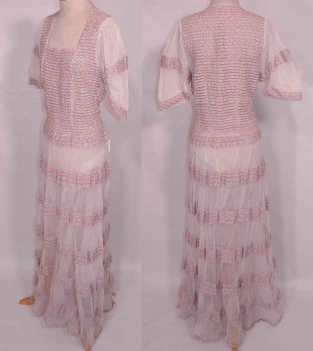 Vintage Pleated White Net Ribbon Floral  Print  Striped Trim Dress. The dress measures 57 inches long, with a 36 inch waist and 34 inch bust. The dress is in good condition. This is truly an amazing wonderful piece of wearable textile art!