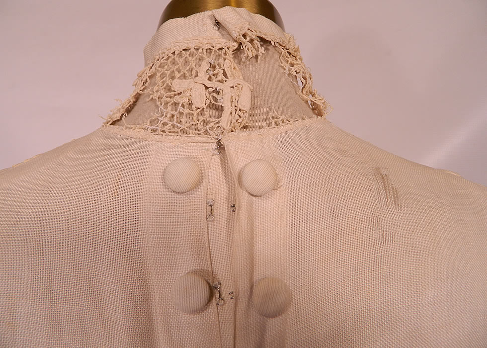 Edwardian White Linen Irish Crochet Lace Soutache French Knot Button Dress. It is in good condition, but has not been cleaned, with a few faint age spot stains, some breaks on the lace back collar and a small fray on the back shoulder (see close-up). This is a wonderful piece of wearable antique textile lace art which could be worn as a wedding gown or graduation dress! 