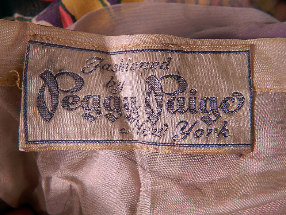 Vintage Peggy Paige New York Label Colorful Silk Chiffon Floral Print Velvet Fairy Dress. There is a "Fashioned by Peggy Paige New York" designer label sewn inside the slip dress. The dress measures 52 inches long, with a 28 inch waist and 34 inch bust.