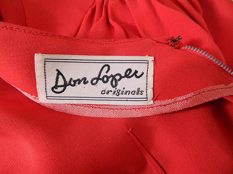 Vintage Don Loper Originals Red Silk Crepe Cocktail Sheath Dress. There is a "Don Loper Originals" designer label sewn inside. The dress measures 42 inches long, with 36 inch hips, a 26 inch waist and 36 inch bust. It is in good condition, with only faint underarm discoloration. This is truly a wonderful piece of wearable designer art! 