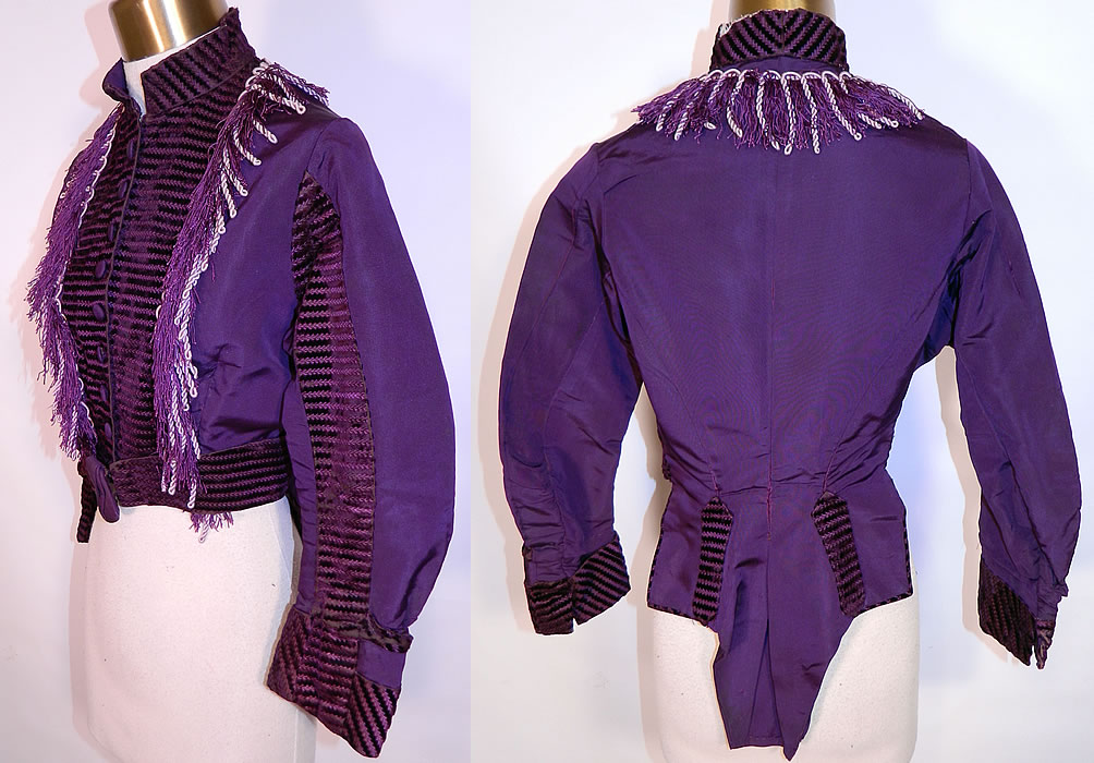 Victorian Purple Plum Silk Velvet Fringe Trim Belted Bodice Top. The bodice measures 14 1/2 inches long in the front, 22 inches long in the back, with a 24 inch waist, 34 inch bust, 12 inch back and 19 inch long sleeves. 