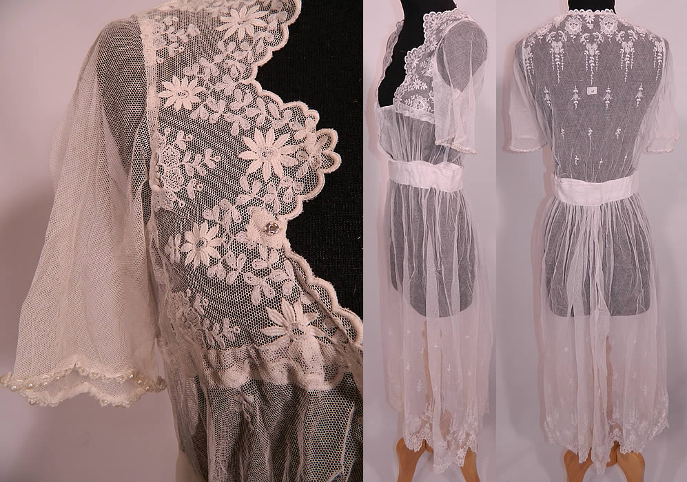 Edwardian White Net Embroidered Tambour Lace Pearl Beaded Dress. This lovely lace summer dress has a scalloped low plunging front neckline, short sleeves, a fitted waistband, mid length skirt with scalloped hemline and snap closures on the front.