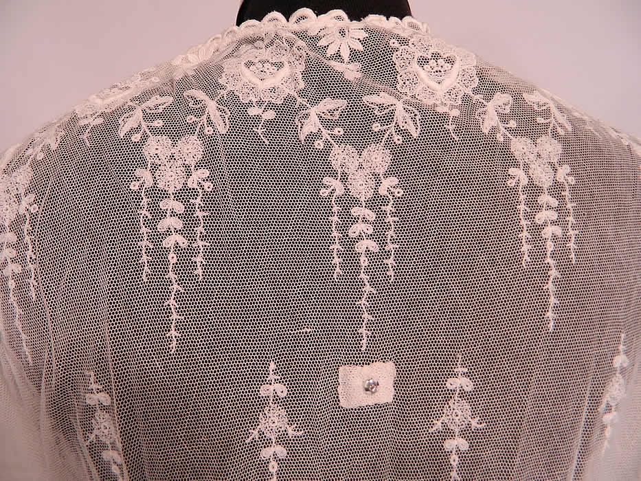 Edwardian White Net Embroidered Tambour Lace Pearl Beaded Dress. Edwardian White Net Embroidered Tambour Lace Pearl Beaded Dress. It is sheer, unlined and missing an overlay top which would have attached with snaps, some snaps still remain on the dress (see close-up). The dress measures 47 inches long, with a 22 inch waist, 34 inch bust and 12 inch back. It is in good condition. This is a wonderful piece of wearable antique lace textile art!