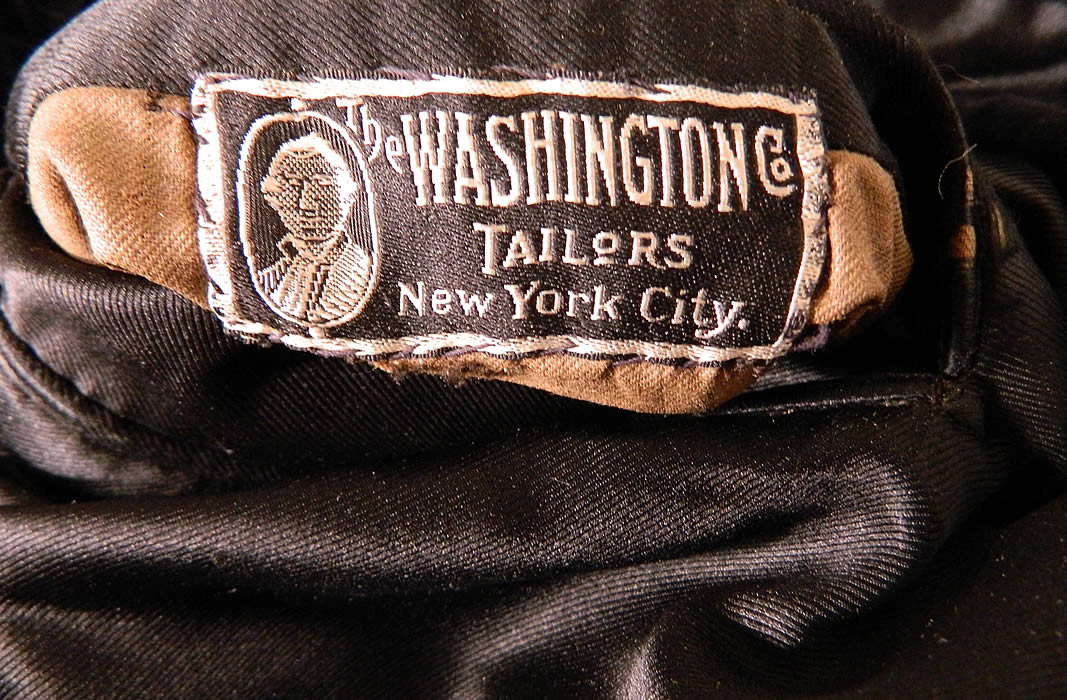 Vintage Washington Co Tailors NY Black Wool Double Breasted Formal Frock Coat. It is fully lined in black silk, with inside breast pocket, "The Washington Co Tailors New York City" label sewn inside it and there is ink stamped cotton lining inside the sleeves. 