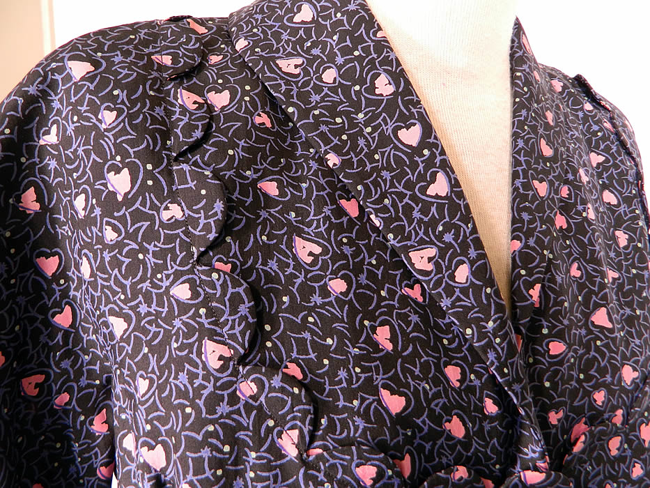 Vintage Mollie Parnis  Heart Novelty Print Silk Circle Skirt Peplum Suit Jacket Dress. It is made of a navy blue silk rayon fabric background, with a pink  abstract Valentine hearts novelty print design.