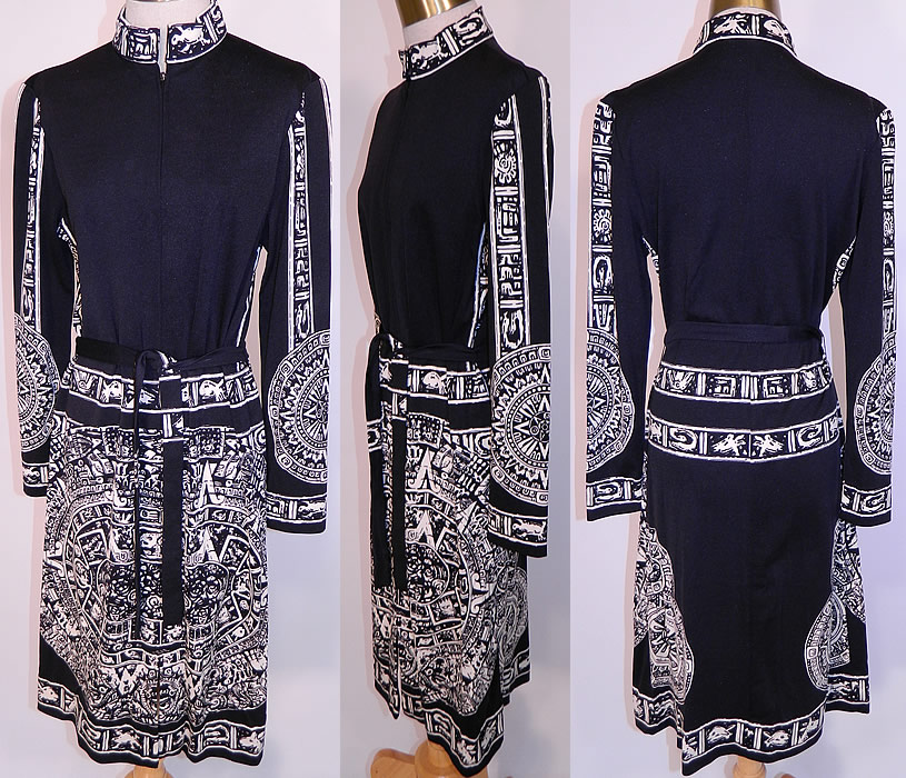 Vintage Paganne Gene Berk Black & White Aztec Mayan Calendar Print Belted Dress. This magnificent mod boho  dress has a mandarin collar, long full sleeves, matching fabric belted tie sash and front zipper closure.