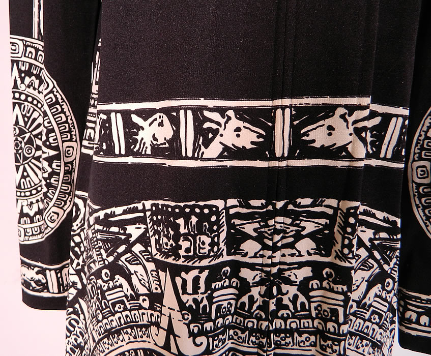 Vintage Paganne Gene Berk Black & White Aztec Mayan Calendar Print Belted Dress.  The dress measures 41 inches long, with 36 inch hips a 34 inch waist, 34 inch bust, 14 inch back and 23 inch long sleeves. It is in good  condition. This is truly a wonderful unique  designer piece of wearable art.