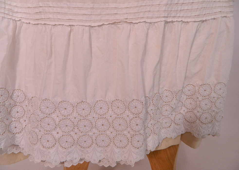 Victorian White Cotton Eyelet Lace Gathered Ruffle Bustle Back Petticoat Skirt. The petticoat measures 36 inches long, with a 30 to 40 inch adjustable waist.