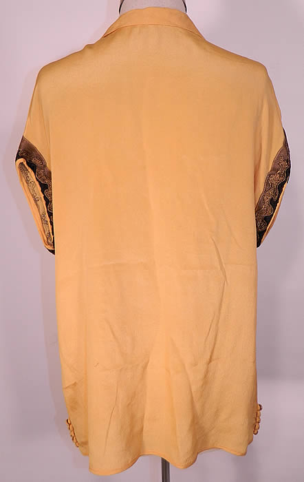 Vintage Art Deco Yellow Silk Black Applique Gold Lame Lamé Embroidered Flapper Blouse. The top measures 25 inches long, with a 38 inch waist and 38 inch bust. It is in good condition. This is truly a wonderful piece of wearable Art Deco textile art.