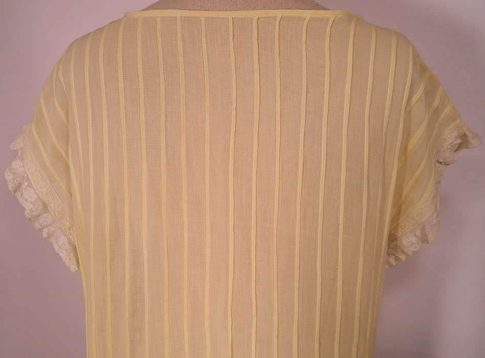 Vintage Pastel Yellow Cotton Pleated  Lace Ruffle Chemise Shift Dress.This lovely lace loose fitting chemise style straight shift summer dress has short cap sleeves and is sheer, unlined. The dress measures 45 inches long, with 38 inch hips, a 34 inch waist and 36 inch bust. It is in excellent condition. This is truly a wonderful piece of wearable antique lace art! 