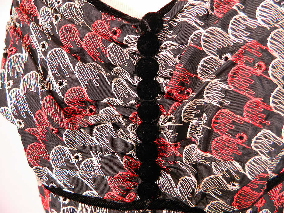 Vintage Red Black White Eyelet Embroidered Stitching Circle Skirt Dress & Shrug Jacket.This stunning summer dress has a sweetheart neckline, spaghetti straps, black velvet trim edging, button accents on the front, stays boning inside the bodice, a full circle skirt and side zipper closure.