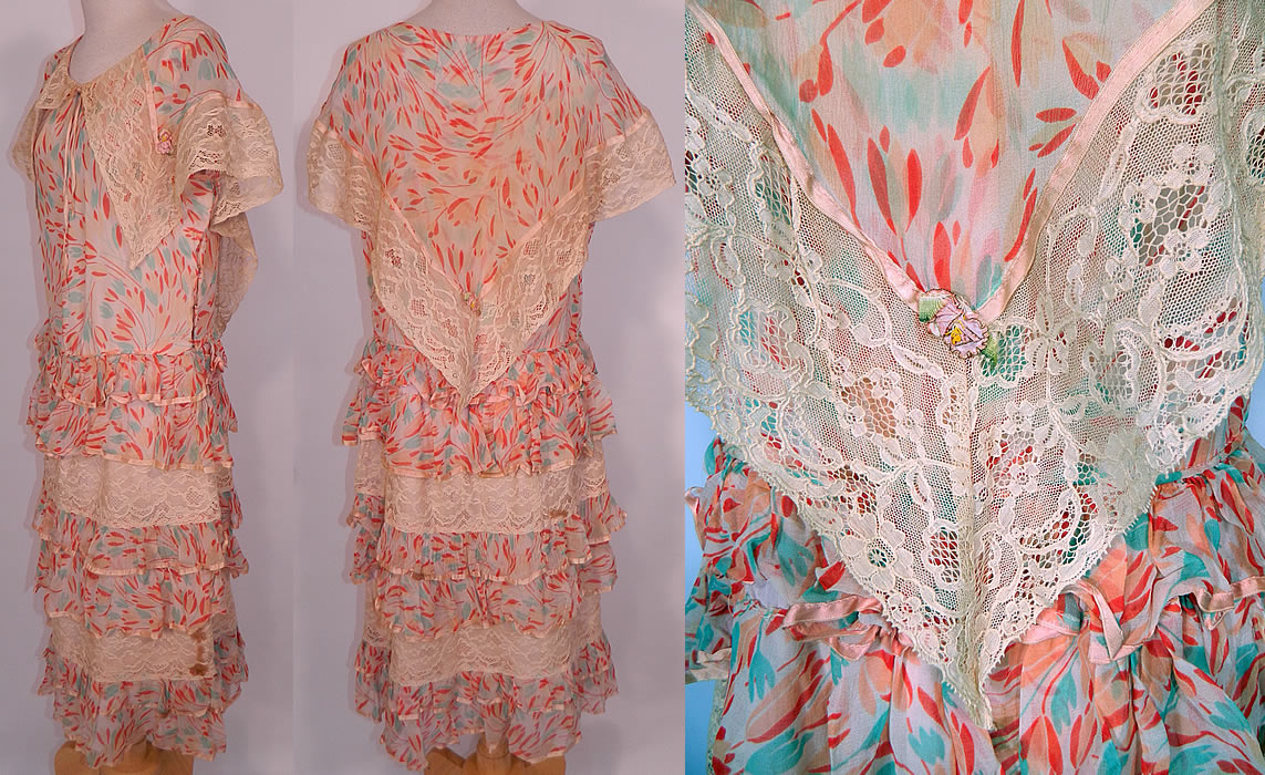 Vintage Silk Chiffon Tulip Print Lace Shawl Collar Ruffle Rosette Trim Drop Waist Dress. This fabulous flapper dress has a loose fitting drop waist style, sleeveless, with a large capelet shawl style collar, a ribbon bow trim neckline, layered ruffled tiered skirt, fully lined in pink silk and has side snap closures. 