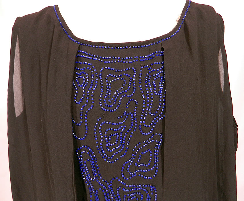 Vintage Art Deco Black Silk Cobalt Blue Beaded Drop Waist Flapper Dress. This fabulous flapper dress has a loose fitting drop waist layered overblouse style, sleeveless, rounded scoop necklines and is lined.