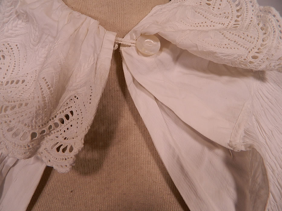 Victorian Broderie Anglaise Eyelet Embroidered Whitework Cotton Pique Cloak Cape. The cape measures 32 inches long, with a 15 inch neck and is 60 inches in circumference.