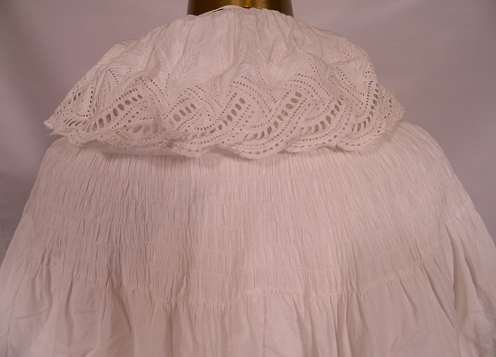 Victorian Broderie Anglaise Eyelet Embroidered Whitework Cotton Pique Cloak Cape. It is in good condition, with only a small mended repair midway down hidden under the back capelet ruffle.