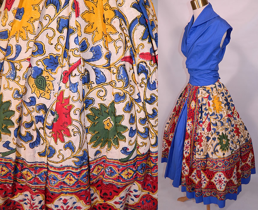 Vintage Tabak of California Sanganer India Hand Block Print Cotton Circle Skirt Dress. This sensational summer sun dress two piece outfit has a blue blouse short cropped top, with a wrap front style sash tie belt closure, short cap sleeves and fold over collar. The top measures 18 inches long, with an adjustable tie waist and 36 inch bust.