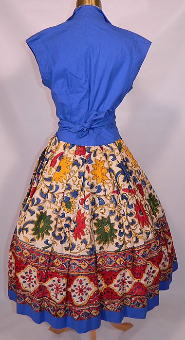 Vintage Tabak of California Sanganer India Hand Block Print Cotton Circle Skirt Dress. Included is a full circle skirt, with pleating around the waist, a matching blue fabric on the front panel and bottom hem trim, with button closure waistband. 