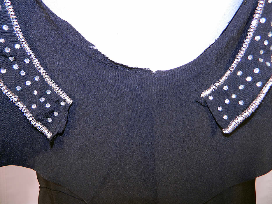 Vintage Art Deco Black Silk Crepe Ruffle Rhinestone Beaded Flapper Dress. It is in fair condition, with some frayed open seams on the sides, underarms, neckline and back neck ruffle trim (see close-up). This is truly a wonderful piece of Art Deco wearable beaded textile art! 