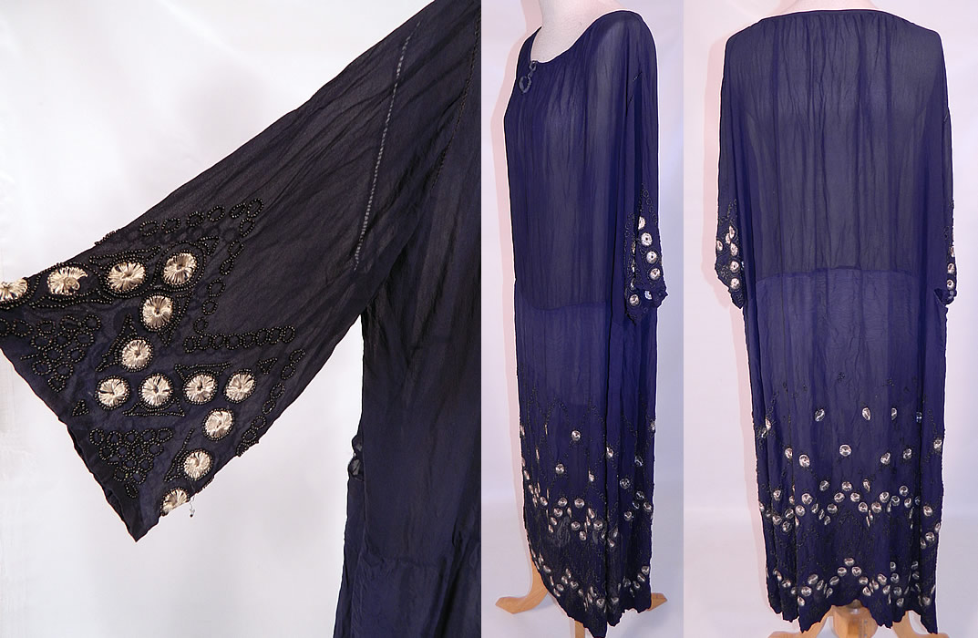 Vintage Art Deco Navy Blue Sheer Silk Chiffon Beaded Polka Dot Flapper Dress. The dress is a large size measuring 47 inches long, with 52 inch hips, a 48 inch waist, 46 inch bust, 20 inch back and 12 inch long sleeves. 