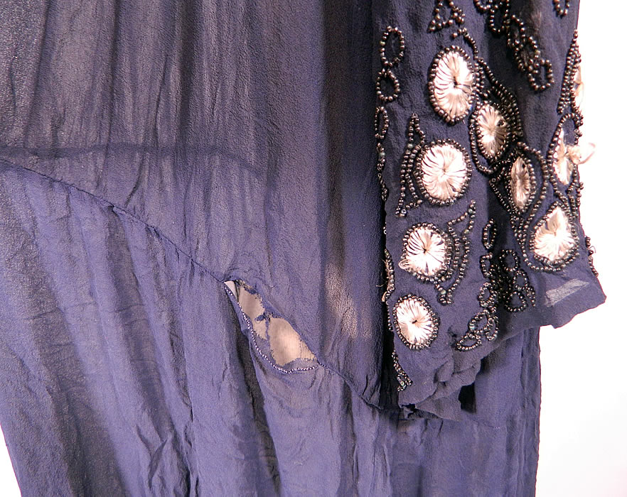 Vintage Art Deco Navy Blue Sheer Silk Chiffon Beaded Polka Dot Flapper Dress. It is in good condition, with only a few loose missing beads and has a small frayed open seam on the back waist (see close-up). This is truly a wonderful piece of Art Deco wearable beaded textile art!