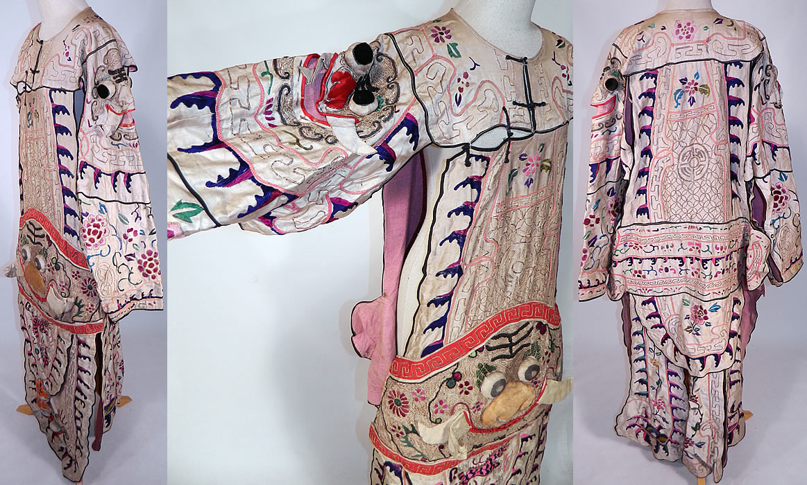 Antique Chinese Dragon Silk Embroidered Peking Opera Warrior Robe
This marvelous theatrical Peking Opera warrior robe costume has a layered tiered tunic drop waist style, is a long floor length, loose fitting with open sides, a split bottom back skirt, long full sleeves open underneath the arms and black trim toggle button front top opening.