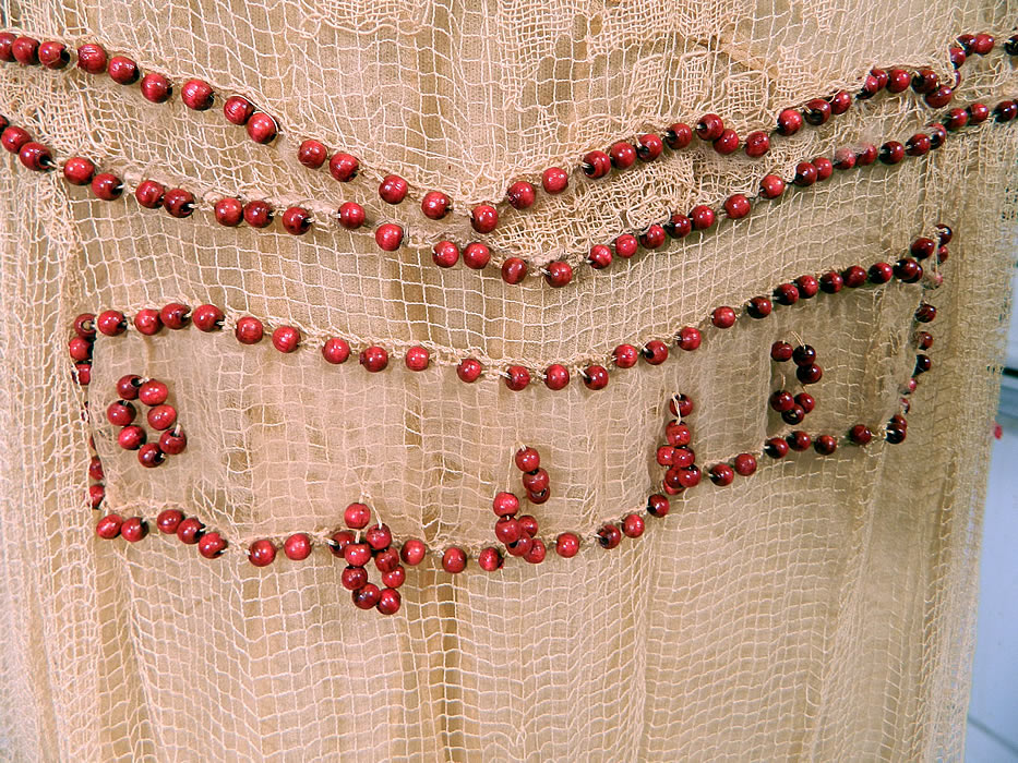 Vintage Cream Crochet Filet Lace Wood Beaded Rosette Drop Waist Flapper Dress
It is in good condition, with only a few missing, loose beads and some tiny holes on the back net skirt and waist area (see close-up). This is truly a rare and wonderful piece of wearable lace art! 