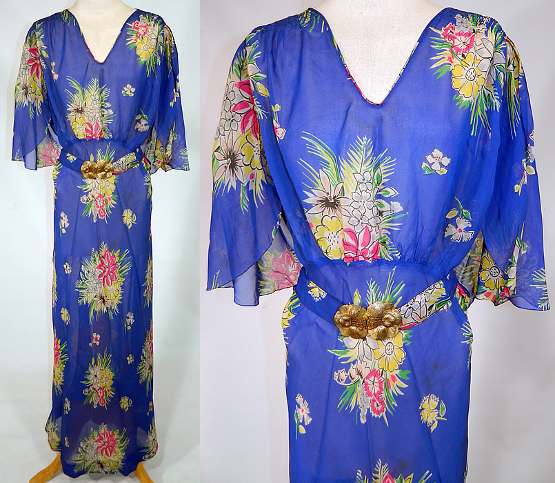 Vintage Blue Silk Chiffon Floral Bouquet Print Belted Bias Cut Dress. 
This vintage blue silk chiffon floral bouquet print belted bias cut dress dates from the 1930s. It is made of a bright royal blue color sheer silk chiffon fabric, with a colorful floral bouquet print pattern design.