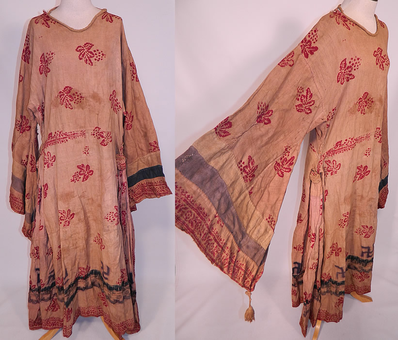 Antique 19th Century Nepalese Nepal Hindu Lakhe Mask Dance Dress Kimono Sleeve
This antique Nepalese Nepal Hindu Lakhe Mask Dance dress with kimono sleeves dates from the late 19th century. It is made of a hand woven muslin fabric with natural dyes and a wood block print of grape leaf and swastika designs.