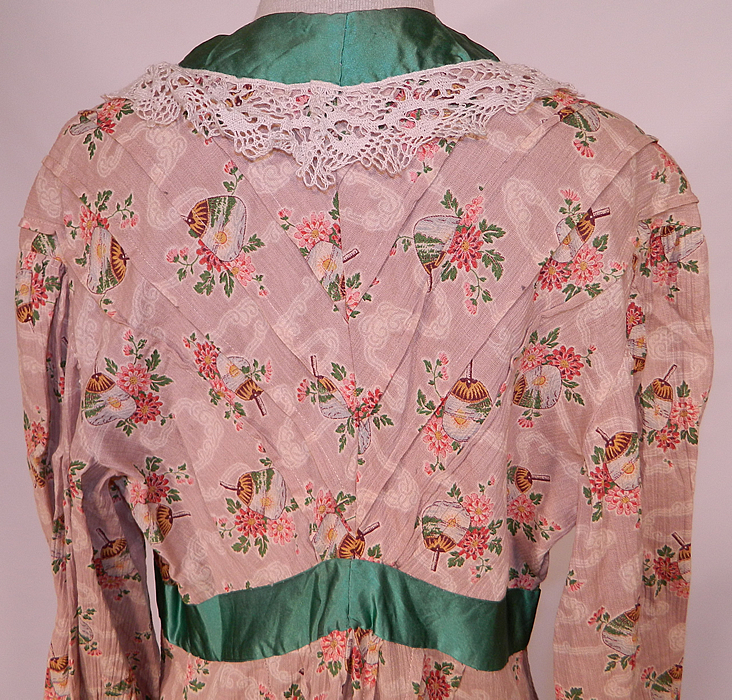 Edwardian Art Nouveau Japanese Floral Fan Print Dressing Gown Robe & Bed Cap Bonnet
The robe measures 53 inches long, with 46 inch hips, a 30 inch waist, 38 inch bust, 16 inch back and 18 inch long sleeves. Included is a matching fabric bed bonnet cap, with lace trim along the bottom and a green ribbon bow on the front.