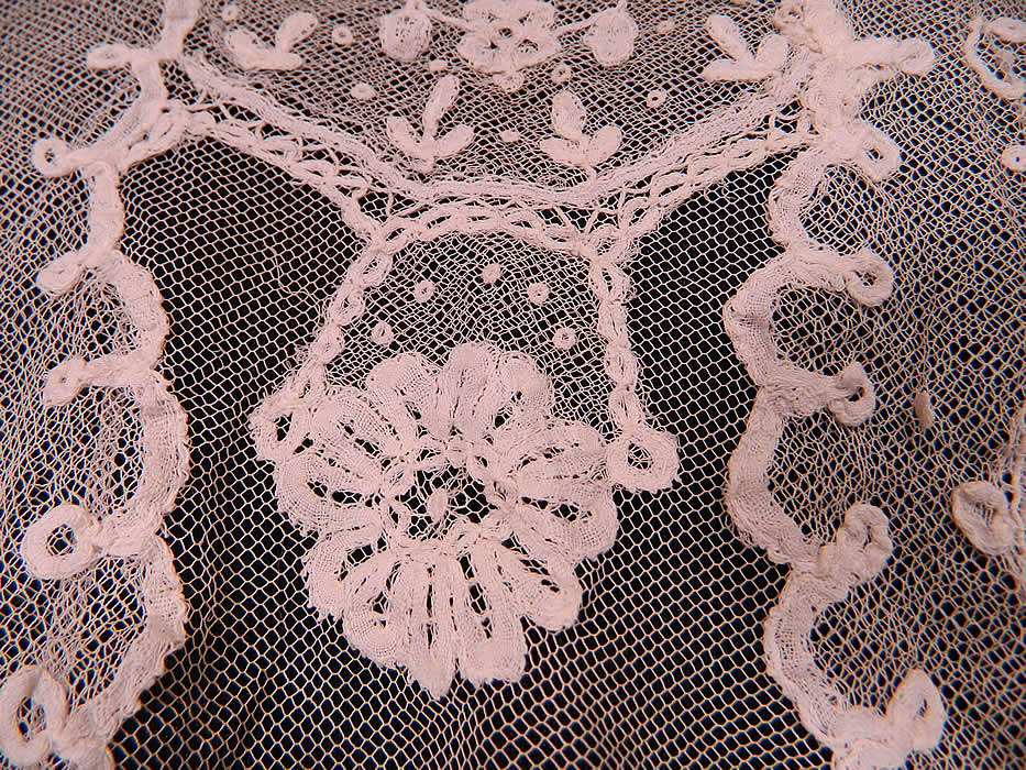 Vintage Edwardian White Net Princess Tape Lace Applique Embroidered Blouse
The top measures 16 inches long, with a 28 inch waist, 38 inch bust, 16 inch back and 22 inch long sleeves. It is in good condition, with only a few small frays breaks in the lace appliqué work on the back (see close-up). This is truly a wonderful piece of wearable lace art! 