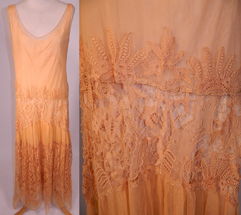 Vintage Peach Net Battenburg Lace Drop Waist Dress Silk Slip & Jacket Outfit
This lovely lace dress is loose fitting, with a drop waist, sleeveless. with low scoop necklines, a slight high low handkerchief style skirt hem and is sheer, unlined. 