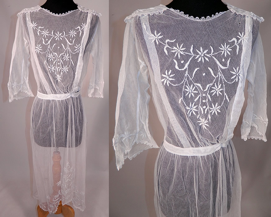 Vintage Edwardian Sheer White Net Floral Embroidered Lace Middy Dress
This vintage Edwardian era sheer white net floral embroidered lace middy dress dates from 1915. It is made of a sheer fine white net, with raised padded satin stitch embroidery work done in a floral daisy vine leaf pattern design and scalloped ace trim edging.