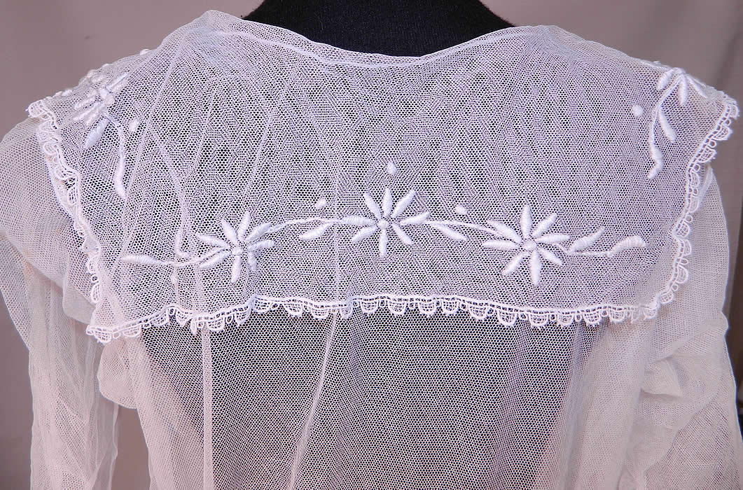 Vintage Edwardian Sheer White Net Floral Embroidered Lace Middy Dress
The dress measures 48 inches long, with 34 inch hips, a 24 inch waist, 34 inch bust and 13 inch back. It is in good condition, with only a tiny pin hole on the front top shoulder area (see close-up). This is a wonderful piece of antique textile art which could be worn as a wedding gown, graduation dress or for a garden party tea! 