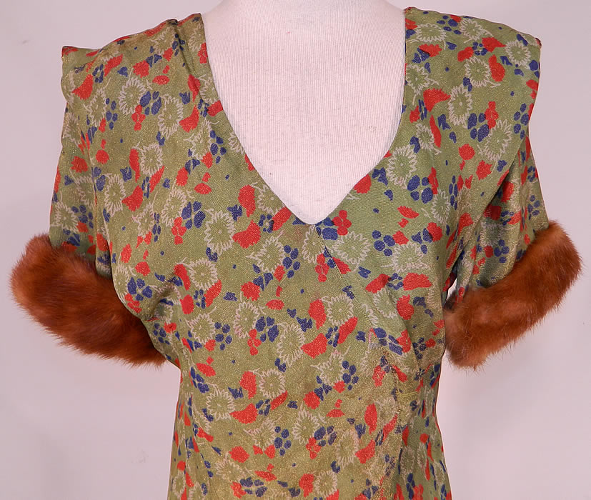 Vintage Green Gold Lamé Lame Floral Print Bias Cut Gown Shawl Collar Fur Trim Cuffs
This beautiful bias gown is a long floor length, with short sleeves, mink fur trim cuffs, a shawl collar cape back, V front neckline and is unlined. 