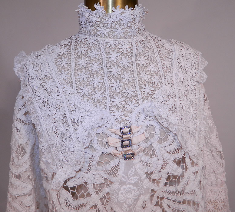 Edwardian White Battenburg Tape Lace Embroidered Applique Blouse Shirt Top
This beautiful blouse has a high neck lace collar, with steel cut buckles, cream silk bow trim on the front, 3/4 length sleeves, hook closures down the back and is sheer completly unlined