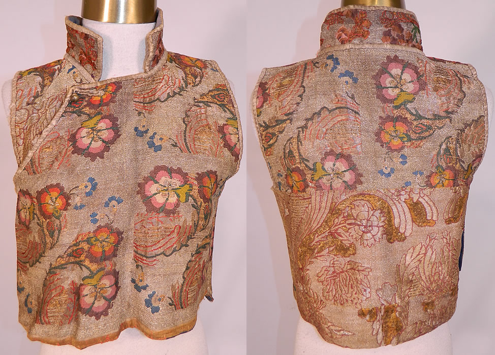 Antique 19th Century Chinese Tibetan Gold Lame Brocade Sleeveless Monks Vest Lamé
This antique Chinese Tibetan gold lamé brocade sleeveless monks vest dates from the early 19th century. It is hand stitched, made of a beautiful brocade fabric woven with gold lamé metallic thread and colorful silk threads creating a fabulous floral leaf weave pattern design.