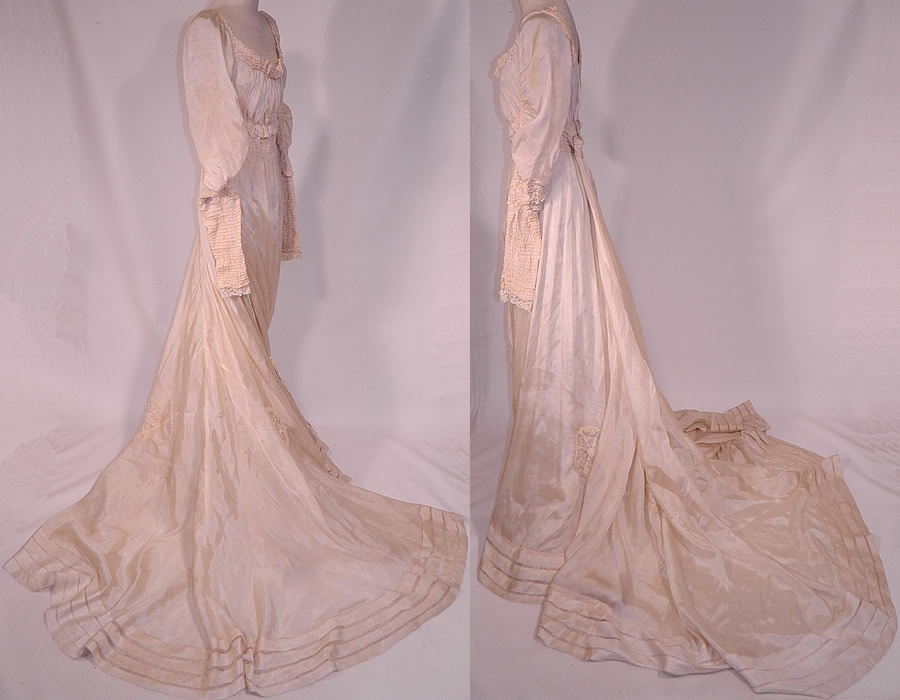 Edwardian Cream Silk Ruched Pearl Beaded Lace Trim Wedding Gown Train Skirt Dress
This beautiful bridal wedding gown dress has a renaissance medieval style, with a very long back train skirt, exaggerated long tapered sleeves, an empire waist, low rounded scoop neckline, hook closures on the back and a white cotton lace ruffle petticoat underskirt with slight back train has been sewn inside lining the skirt. 