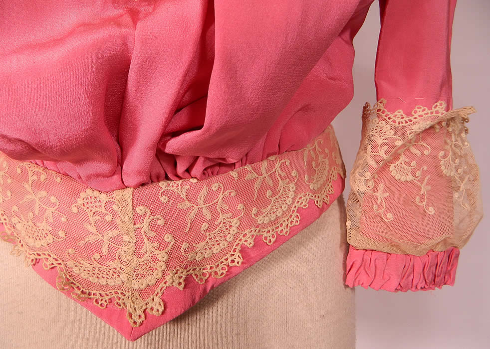 Victorian French Rose Pink Silk Wool White Lace Ruffle Trim Bodice Shirt
This beautiful bodice shirt top, has a high neck band collar, long full sleeves with gathering, lace trim cuffs, a fitted V waistband, slight pouter pigeon front, back hook closures and is fully lined inside.