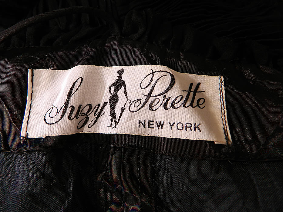 Vintage Suzy Perette NY Label Black Silk Pleated Ruffle Spaghetti Strap Cocktail Dress
There is a "Suzy Perette New York" designer label sewn inside. The dress measures 42 inches long, with 34 inch hips, a 24 inch waist and 34 inch bust. It is in excellent condition. This is truly a wonderful piece of wearable art!