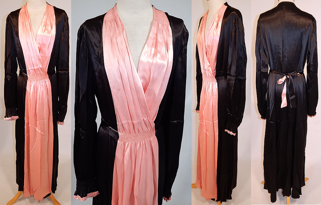 Vintage Jesfor Label Black & Pink Satin Belted Peignoir Robe Dress Gown
This vintage Jesfor label black and pink satin belted peignoir robe dress gown dates from the 1940s. It is made of a luxurious black and pink silky satin fabric, with smocking ruched gathering details on the front waist and shoulders. This pretty pink peignoir robe dressing gown is a long floor length, with a wrap around style, long full sleeves with gathered ruffle cuffs, pleated pink front accents, an attached sash belt tie back for closure