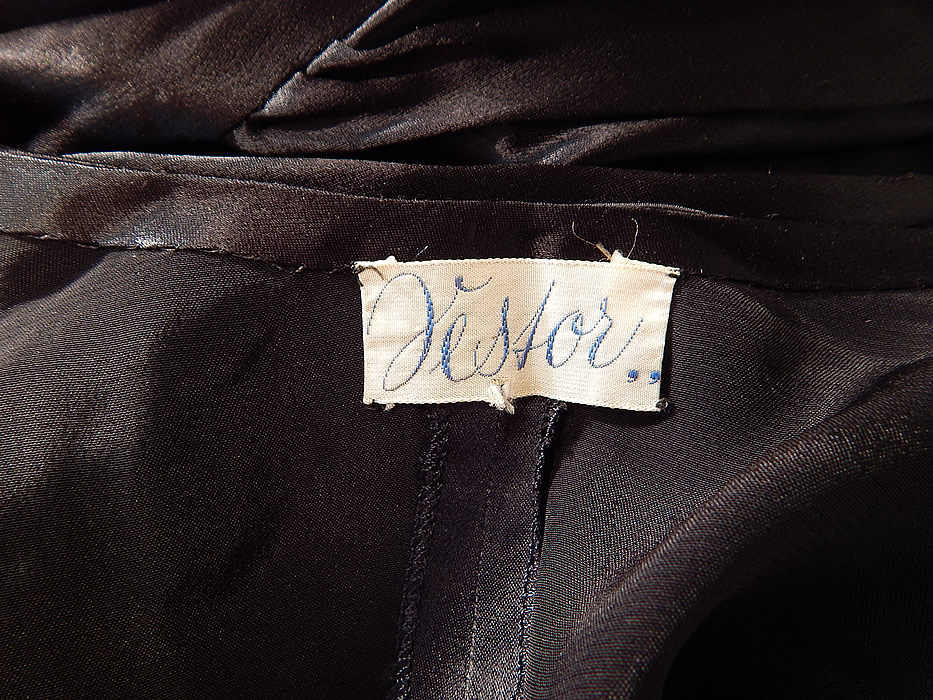 Vintage Jesfor Label Black & Pink Satin Belted Peignoir Robe Dress Gown
There is a "Jesfor,," label sewn inside. The robe measures 54 inches long, with a 40 inch waist, 42 inch bust and 27 inch long sleeves. It is in excellent condition. This is truly a wonderful unique piece of fine quality romantic wearable lingerie art!