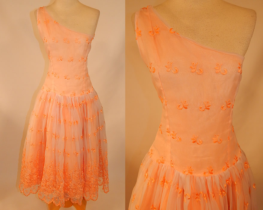 Vintage Peach Pastel Organdy Eyelet Embroidered One Shoulder Circle Skirt Dress
This vintage pastel peach eyelet embroidered one shoulder circle skirt dress dates from the 1950s. It is made of a iridescent pastel peach color sheer organdy fabric, with an eyelet embroidered cut work floral pattern design. 