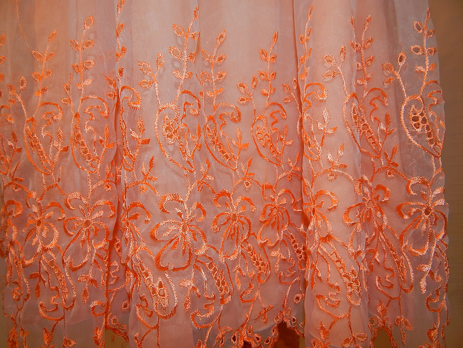 Vintage Peach Pastel Organdy Eyelet Embroidered One Shoulder Circle Skirt Dress
The dress measures 43 inches long, with a 28 inch waist and 34 inch bust. It is in excellent condition. This is truly a wonderful piece of wearable art!